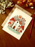 Cottagecore Mushroom House Greeting Card – Whimsical Watercolor Art